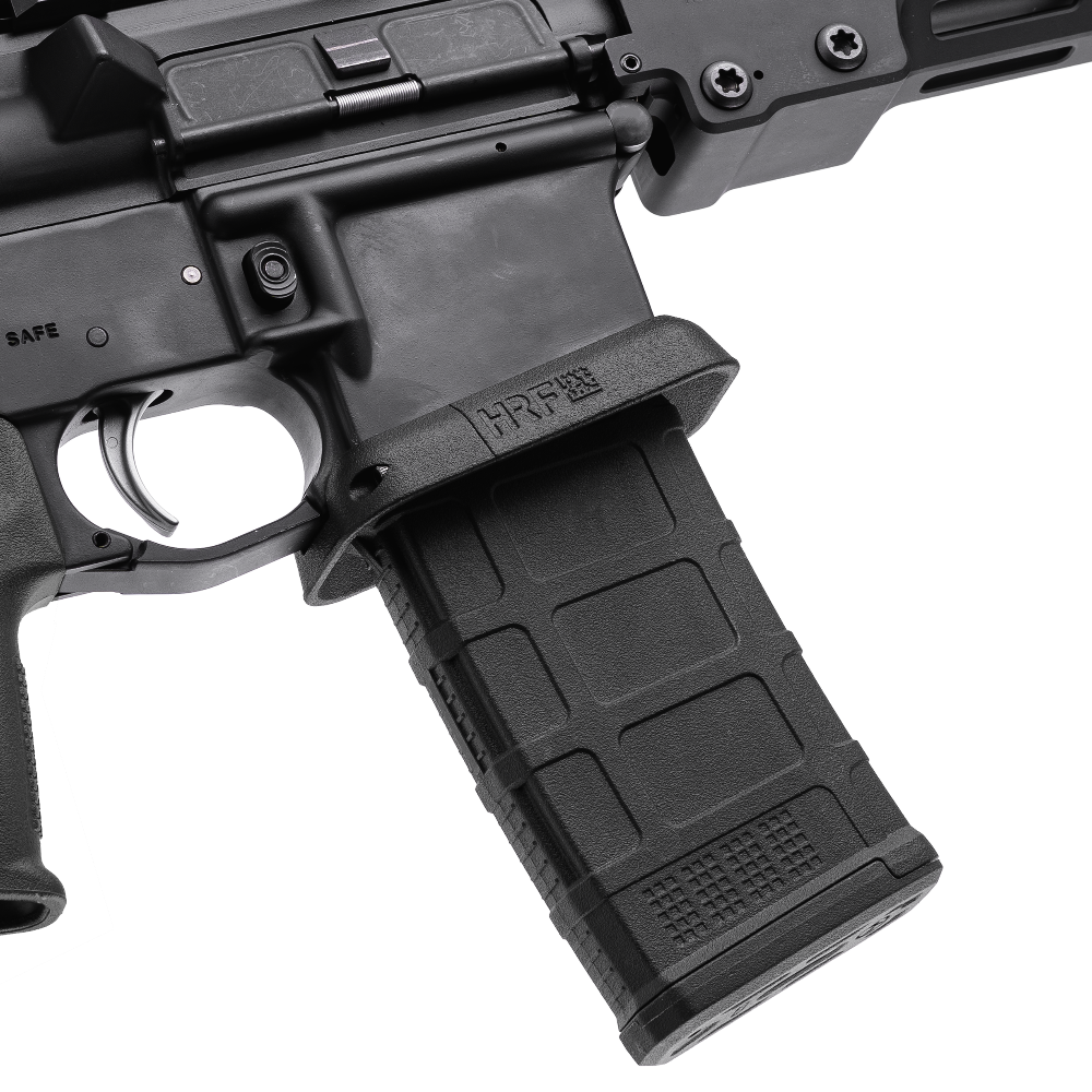 AR-15 with HRF Concepts RCM Rifle Combat Magwell in matte black, featuring a flared funnel design for faster reloads and enhanced weapon control, shown with a PMAG magazine inserted