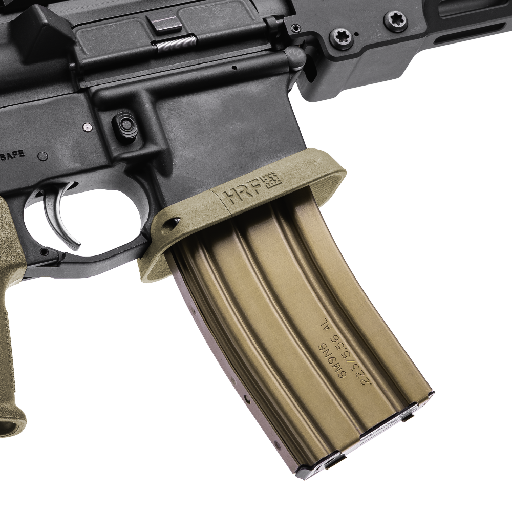 AR-15 with HRF Concepts RCM Rifle Combat Magwell in FDE, featuring a flared funnel design for quicker reloads and improved weapon handling, shown with a tan aluminum STANAG magazine inserted